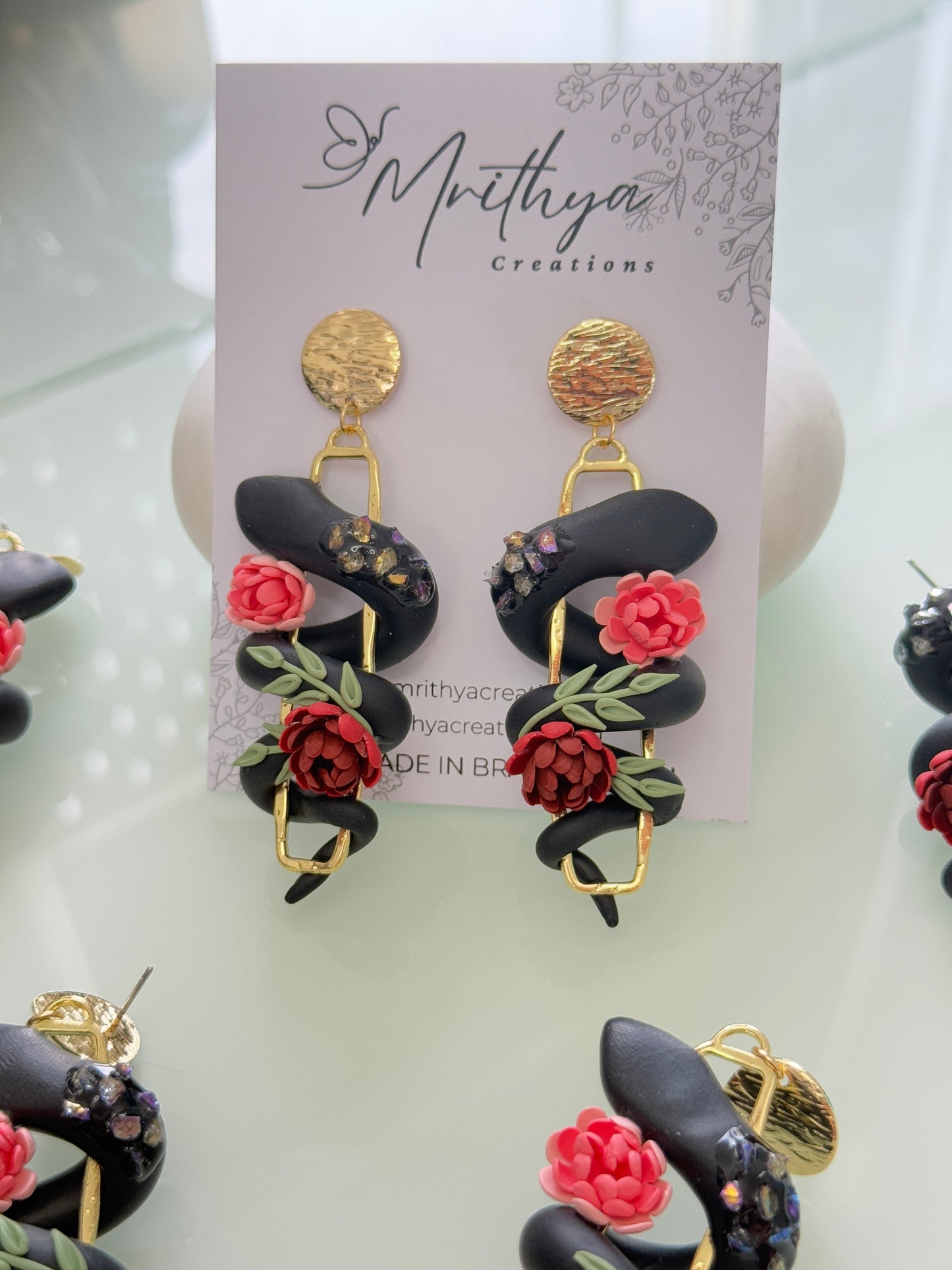 Serpent floral earrings