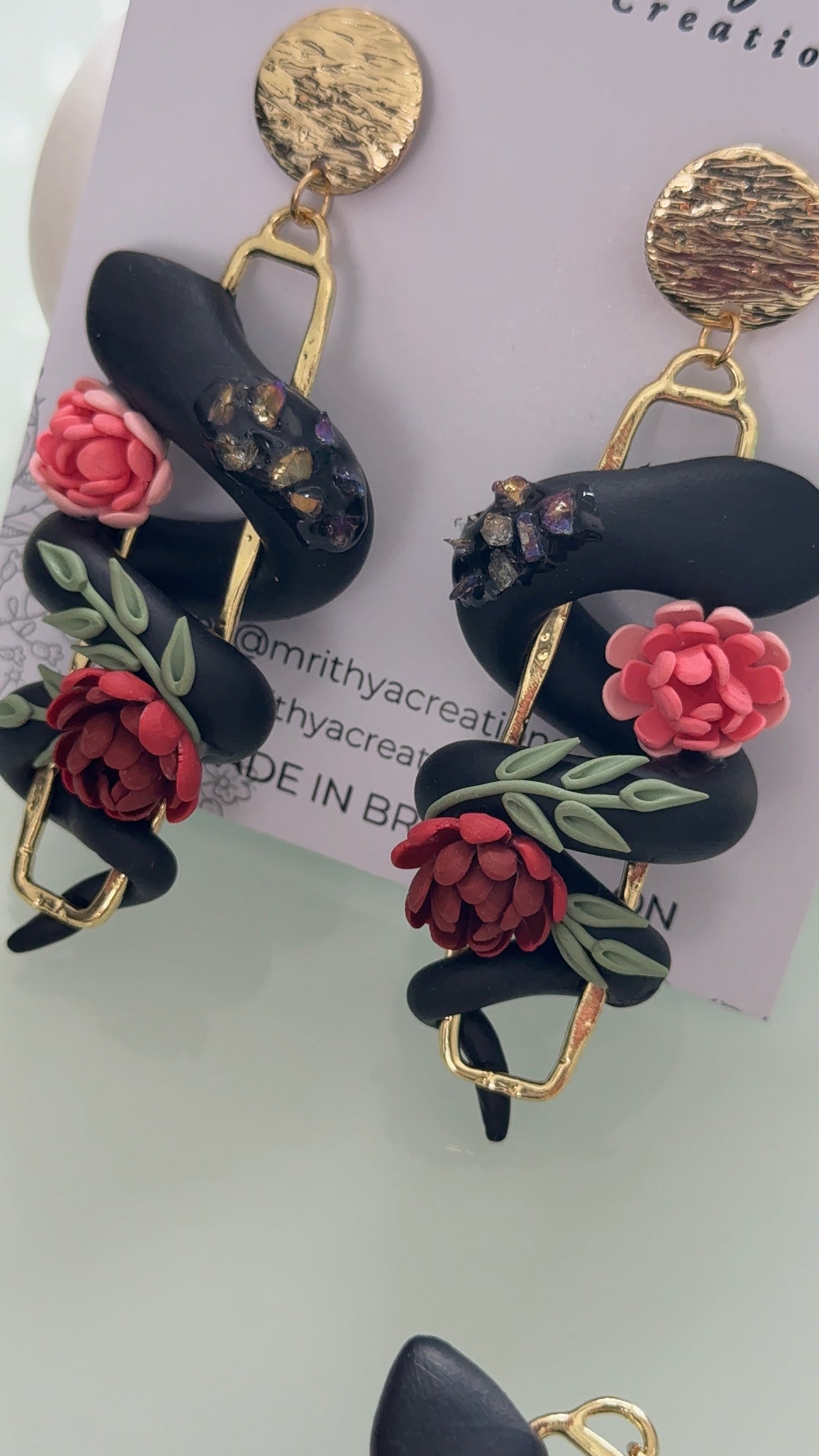 Serpent floral earrings
