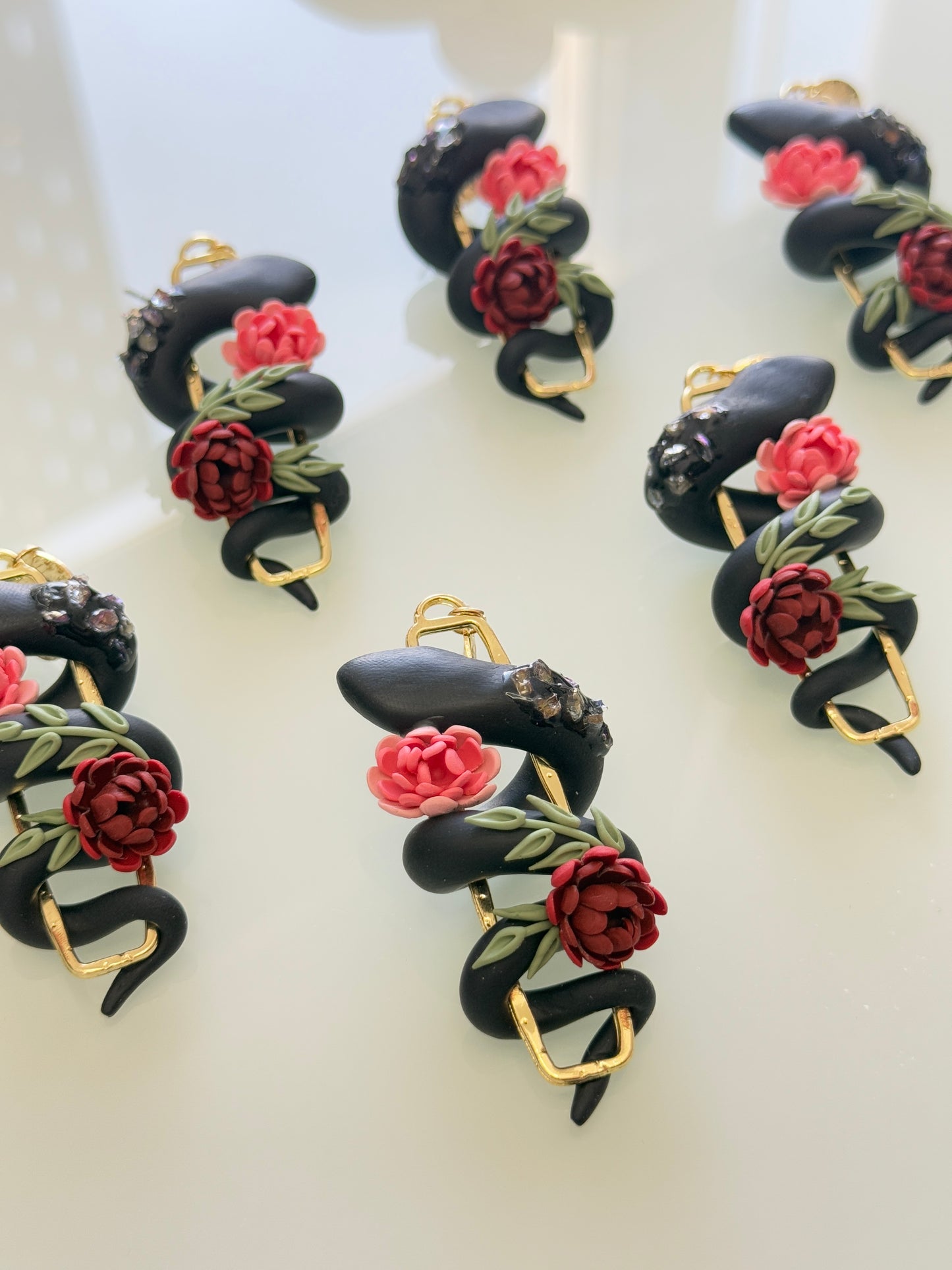 Serpent floral earrings