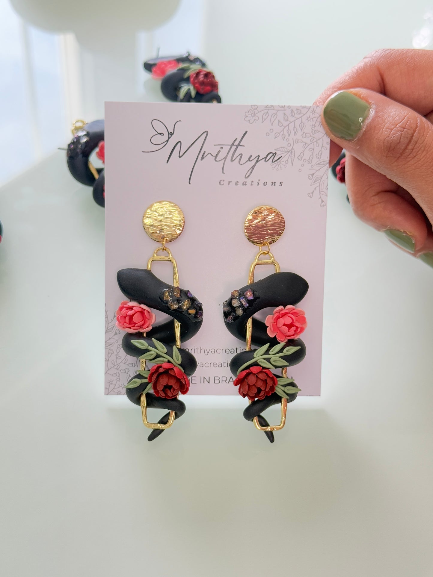 Serpent floral earrings