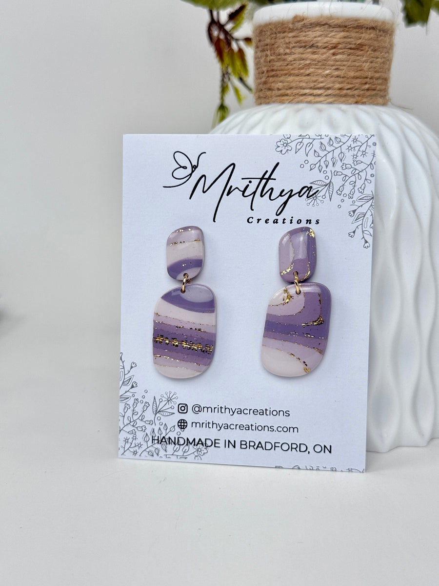 Purple M oval